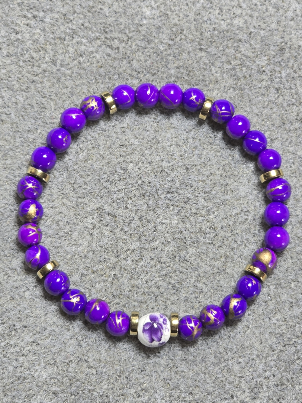 Purple & Gold Marbled Stretch Bracelet w/ Gold Spacers & Floral/White Focal Bead